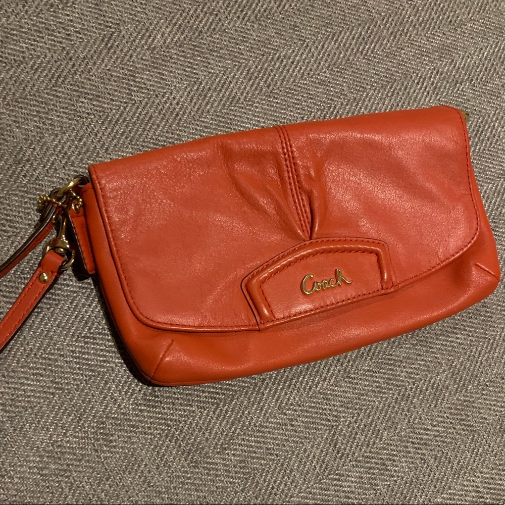 Orange leather Coach wristlet